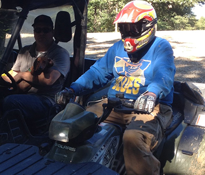 James riding his ATV with his LVAD ... one year later