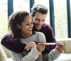 Happy couple with pregnancy news