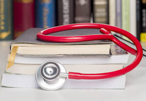 Stack of books with stethoscope