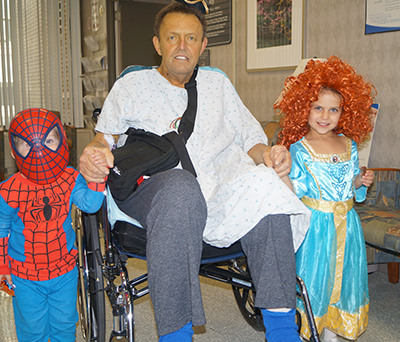 James Brooks one month after LVAD, with Spiderman and a Princess