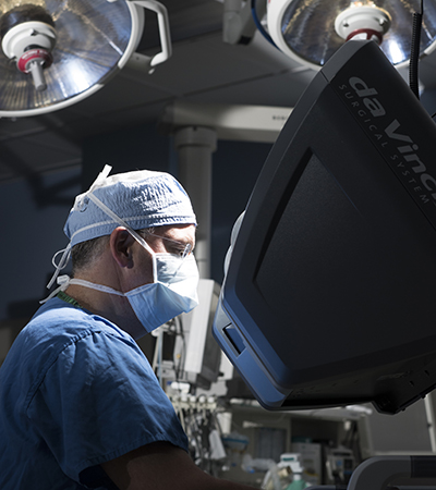Benjamin Kowozer, MD, performing robotic-assisted surgery