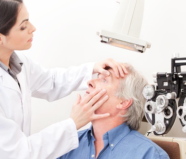 Eye doctor examining patient