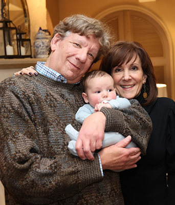 Dr. Wexler and his wife with their grandbaby